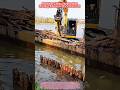 Satisfying Marine Engineering: Floating Excavator Piles Riverbank! 🏗️🌊