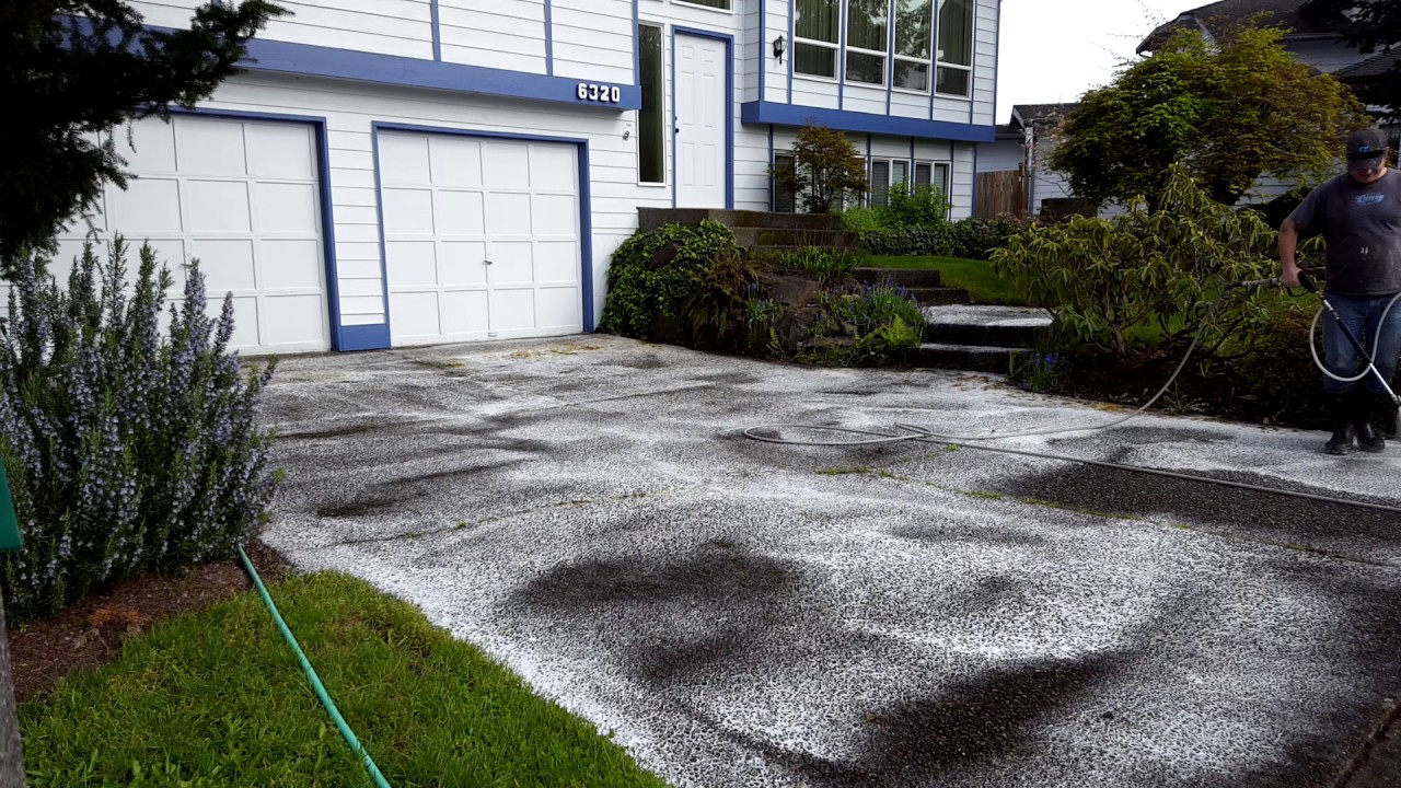 Pressure washing a driveway in Auburn Washington