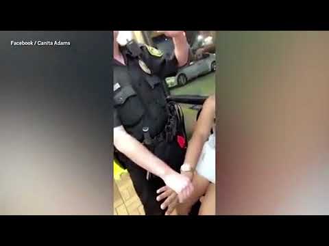 White cops expose black woman  breasts during arrest