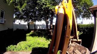 digging out driveway with case 580 sm pt2