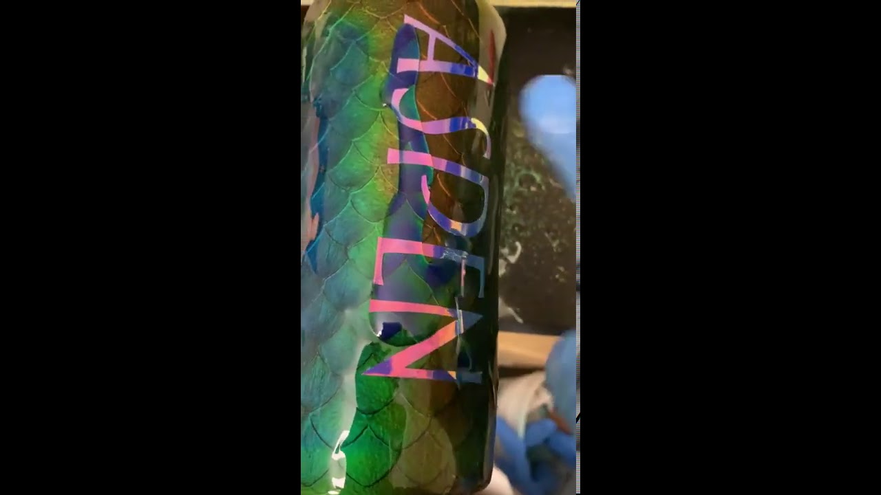 Final layer of epoxy resin on a mood ring dragon scale tumbler