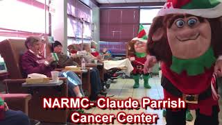 Elves dancing with the crew from Claude Parrish Cancer Center
