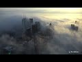 Fog Rolls Over Toronto As Seen From Top of CN Tower