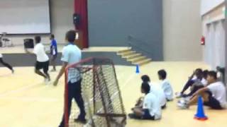 Teachers and students having a hand with the ball