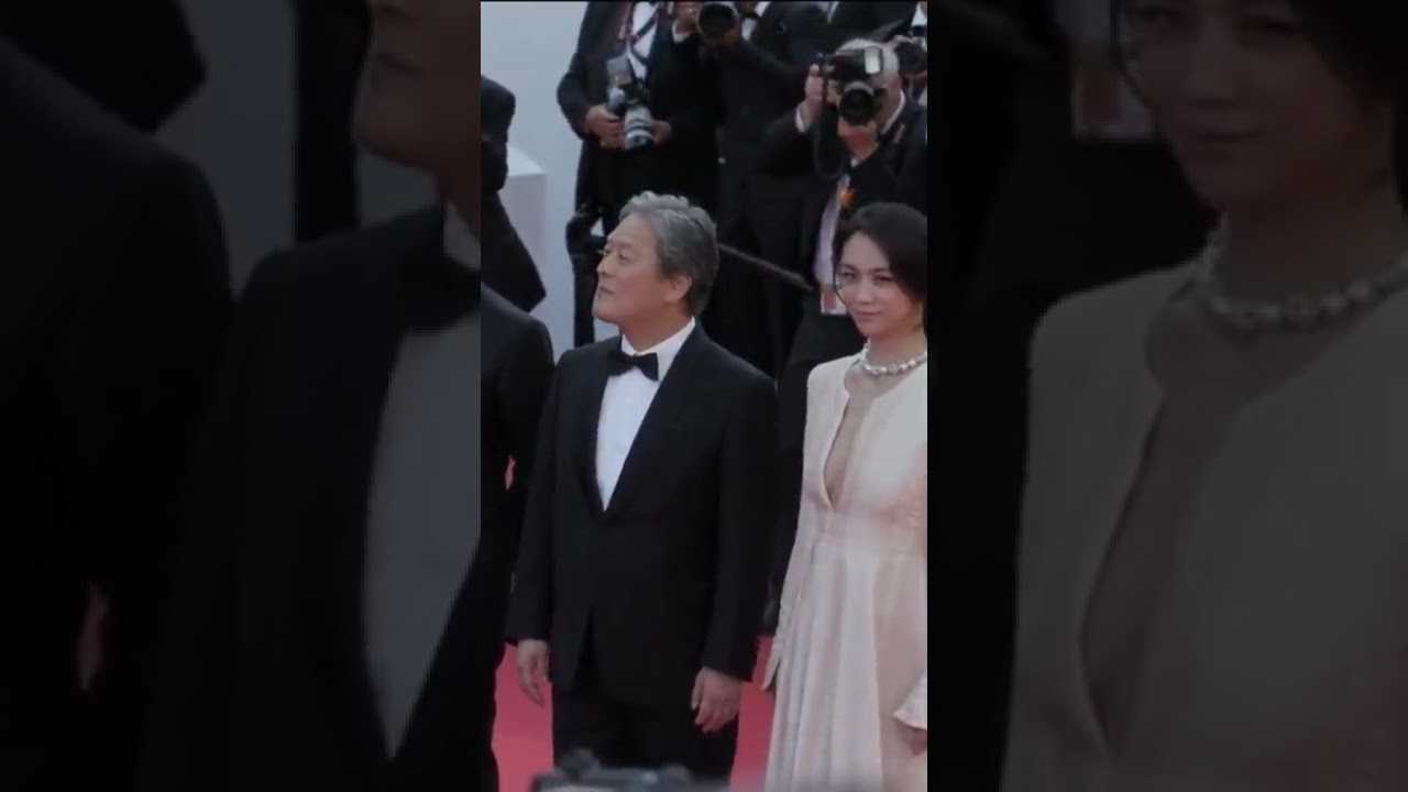 Park Hae-il, Park Chan-wook and Tang Wei pose on the red carpet at the premiere of 