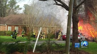 2 firefighters hospitalized following Suffolk garage fire