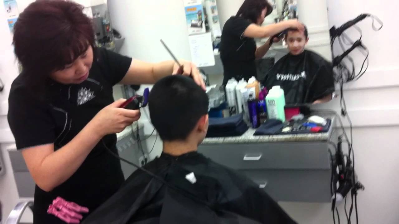 Daniel getting a buzzcut.