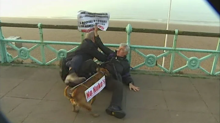Protester tackled to ground by Iain Dale during li...