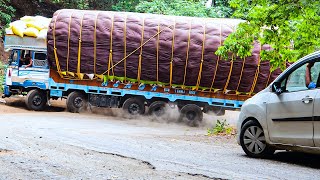 Overspeeding truck driver with 14 tires & 40 tons load Car moves aside for Lorry near Hairpin Bend