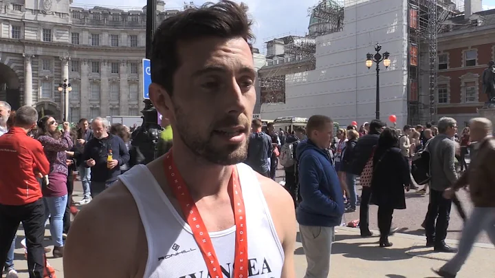 Matthew Rees Helps Competitor Across The Finish Li...