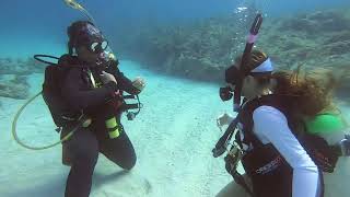 Female Dive Instructor Teaches New Diver