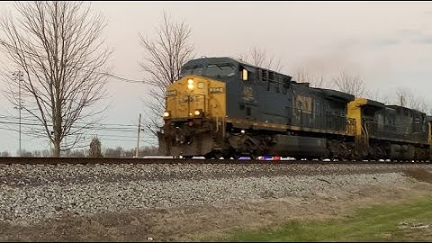CSX Mixed Freight Train Moves Down The Rails With Extra Horsepower In Kentucky On A Warm Fall Day.