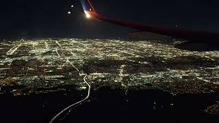 United Airlines Flight landing in LAX at night