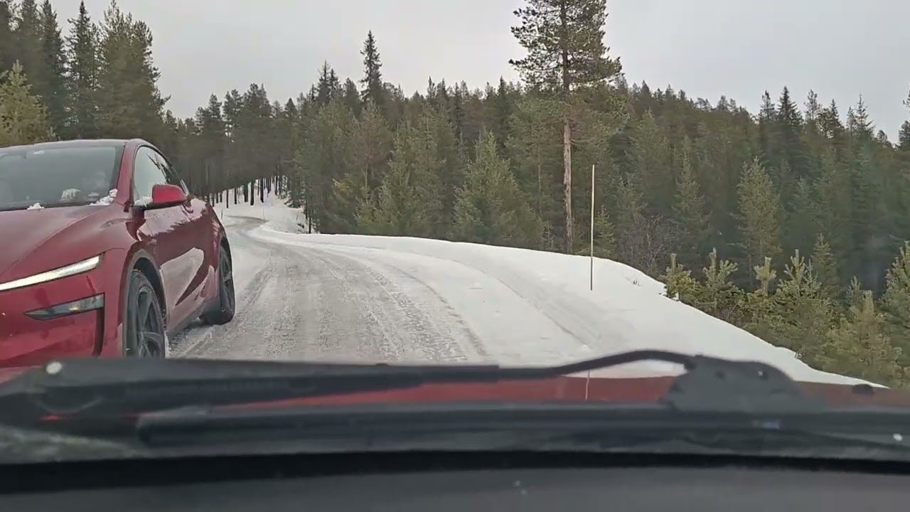 Fighting soft ice and snow while driving up a Norwegian hillside.