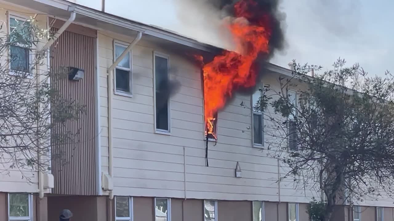 Firefighters fight a blaze at an apartment complex in Victoria - YouTube