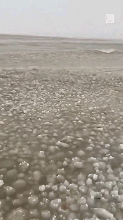 Video: Balls of ice wash ashore at lake in Canada as temperature