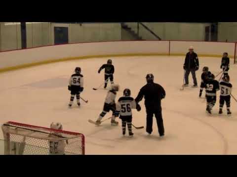 Daniel's first hockey game - #8 in black (He comes...