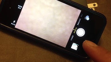 My iphone 5 ios 7. How to switch filters in camera mode.  The 3 circles above camera button