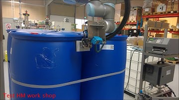 HM robotic labelling on 4 sides of pallet tanks