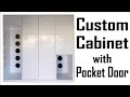 Custom cabinet with pocket doors  makerman