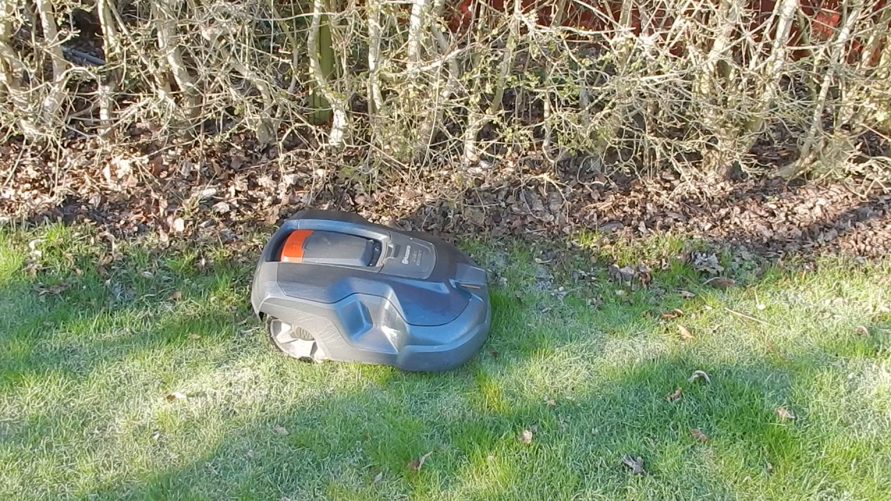 Husqvarna robotic lawn mower doing its duty. YouTube