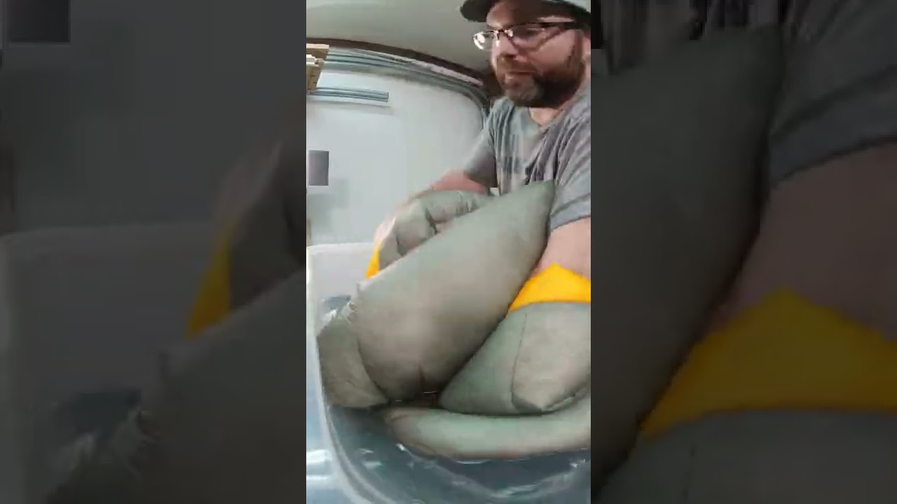 Trying to get down sleeping bag wet. motocamping camping 