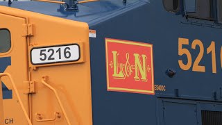 Northbound CSX Autorack M252 Clears sharp road At CP 102 with L&N sticker leading 