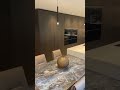 Dark Oak kitchen with hidden door to the laundry room #interiordesign #kitchen #eggersmann #miele