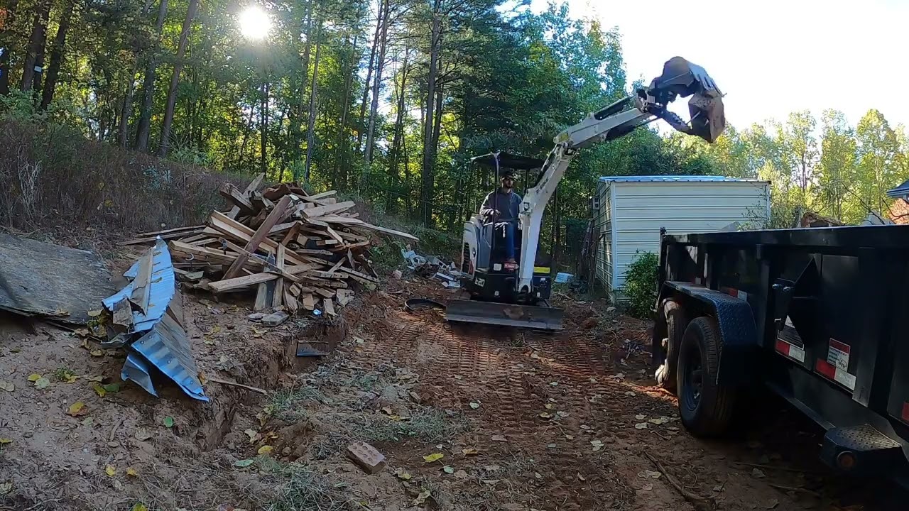 Bobcat E20 Cleaning up old Landscape