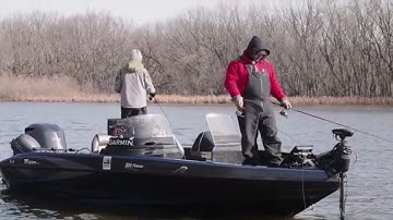Fishing from the Back of the Boat in a River