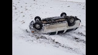 Righting a flipped suburban in the snow