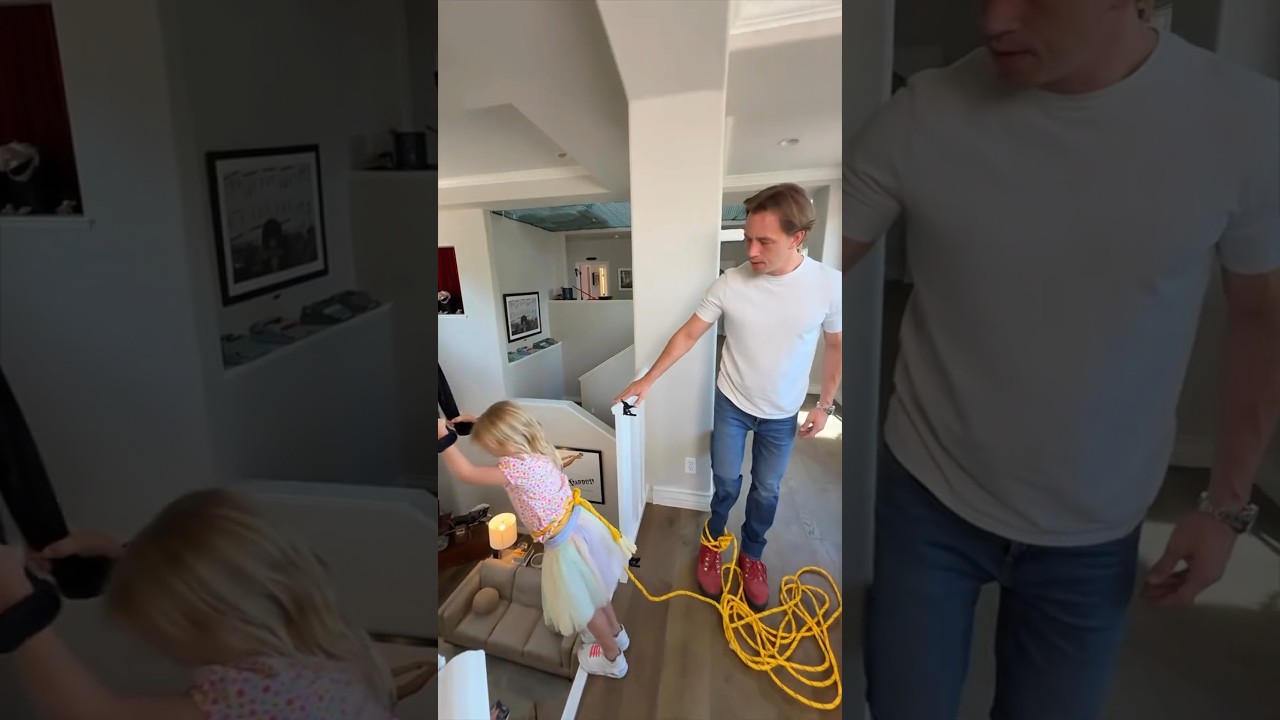 She sat down, holding a rubber rope, and jumped down. 