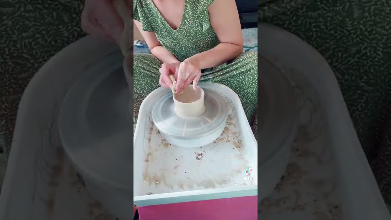 Throwing a butter bell on pottery wheel 