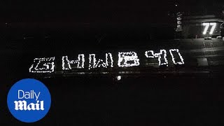 USS George H.W. Bush crew holds a flashlight vigil