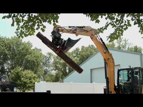 Cat® TRS6 Tiltrotator with Grapple at Work