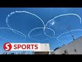 Japan's air force team flies over Tokyo Olympic Stadium