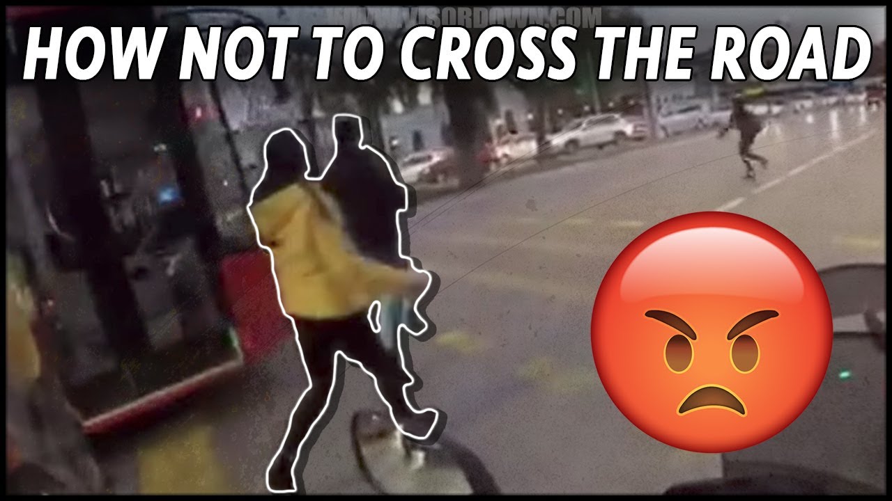 Motorcycle helmet cam captures the moment pedestrian nearly gets hit by ...