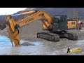 Hyundai 320 Excavator Digging Gravel Under Water