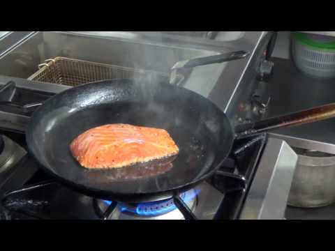 Fish People's Cafe make pan-seared Scottish salmon with garlic greens
