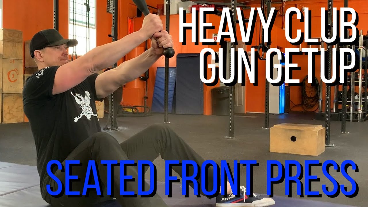heavy club fitness - gun getup 1- seated club front press