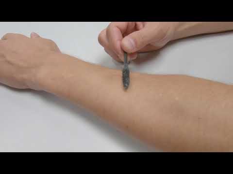 M-Hair: Creating Novel Tactile Feedback by Augmenting the Body Hair to Respond to Magnetic Field