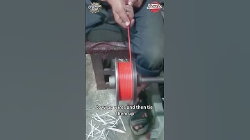 Workers use a wire winding machine to wrap wires and then tie them up