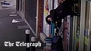 video: Watch: Woman lifted into the air after jacket snags on shutters