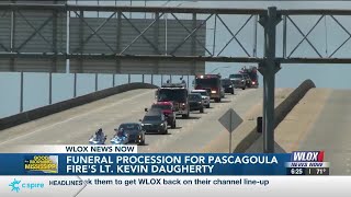 First responders honor Pascagoula Fire Lieutenant Kevin Daugherty at funeral procession through J...