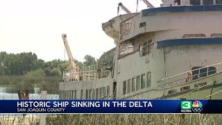 Sinking boat in the Delta leaking diesel fuel and oil