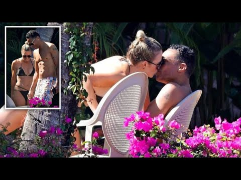 Former GMA3 hosts T.J. Holmes and Amy Robach shared a kiss while at a poolside resort in Mexico