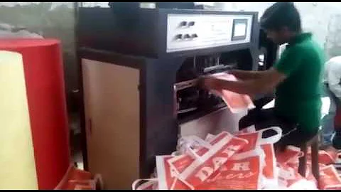 AUTOMATIC NON WOVEN SOFT LOOP HANDLE MAKING MACHINE