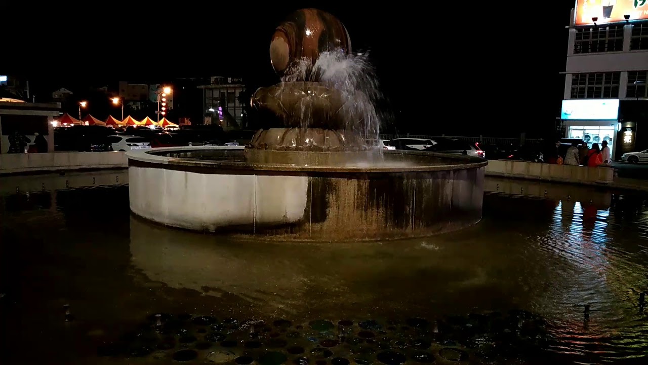 Giant rolling stone ball water fountain