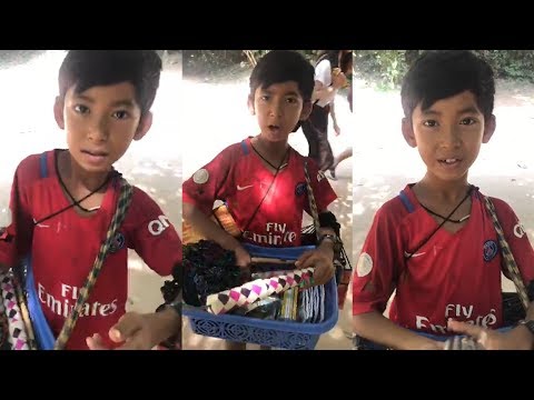 Young souvenir seller shows off linguistic skills