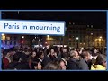 Parisians sing as the Notre Dame cathedral burns
